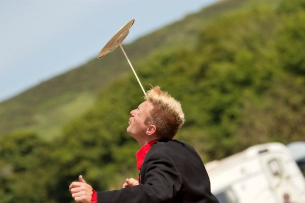 Traditional plate spinner juggling convention performance show circus skills workshop event entertainment